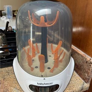 Baby Brezza Bottle Sterilizer & Dryer in White with Orange Inserts